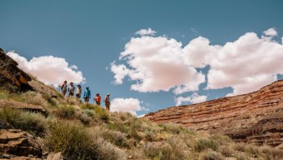 Hikers acending a rim along the San Juan River in Utah
