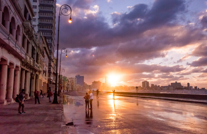 A vibrant sunset on the streets of Havanah in Cuba.