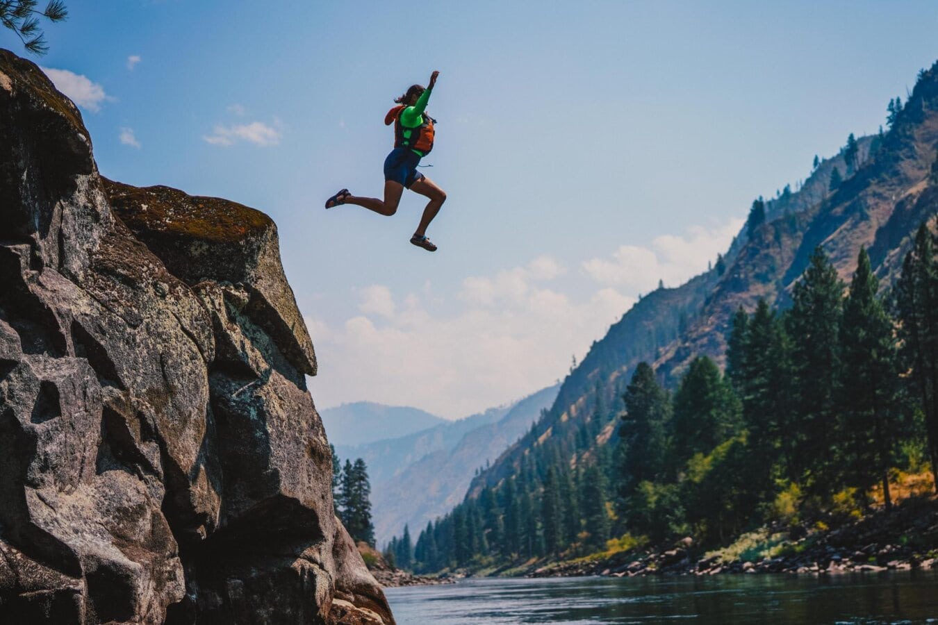 A woman jumps off a rock into the Main Salmon River in Idaho.
