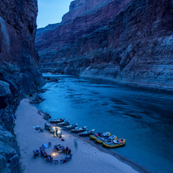 OARS rafts and dories stop to camp for the night deep in Grand Canyon