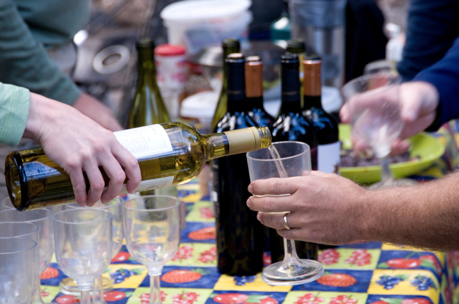 Close up of a glass of wine being poured for a guest on a Rogue River wine trip.